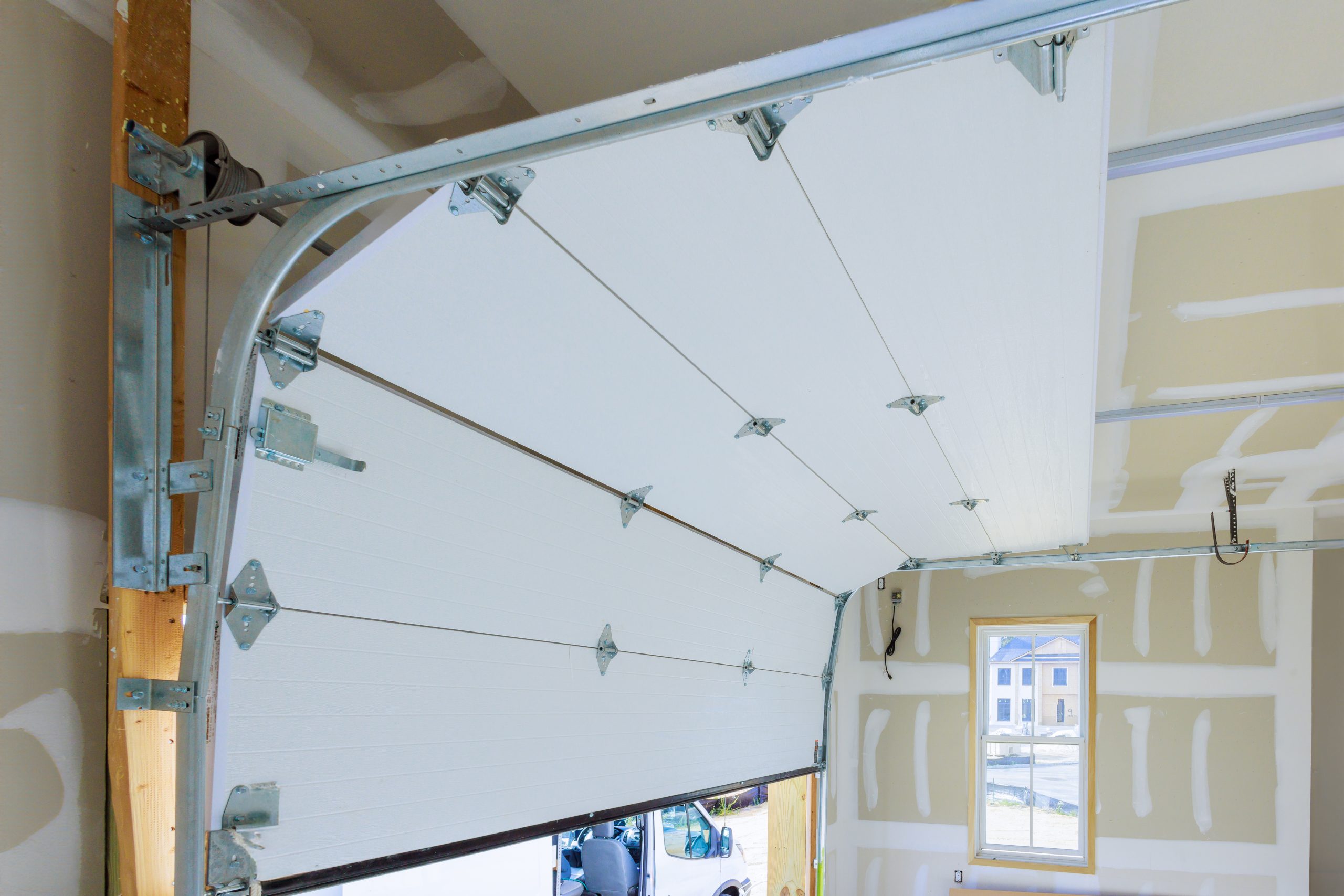 Insulated garage door with energy efficiency